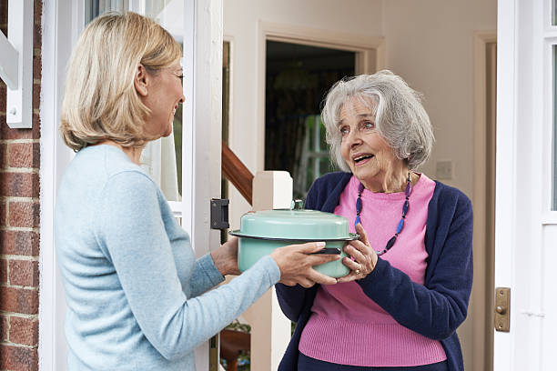 Neighbor delivering a home cooked meal